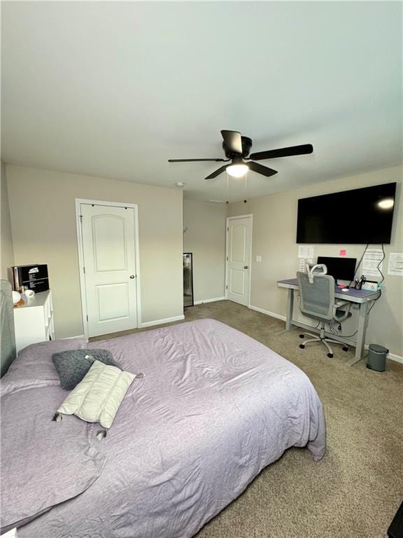 bedroom with carpet flooring, ceiling fan, and baseboards