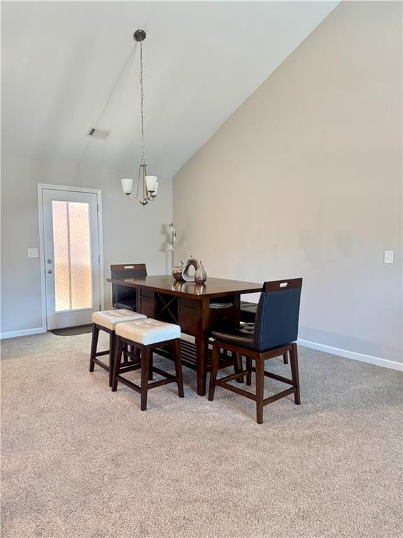 dining space with visible vents, light carpet, baseboards, and an inviting chandelier