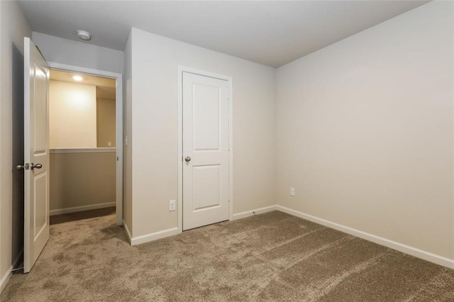 unfurnished bedroom featuring carpet flooring