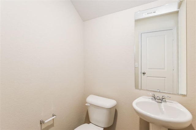 bathroom featuring sink and toilet