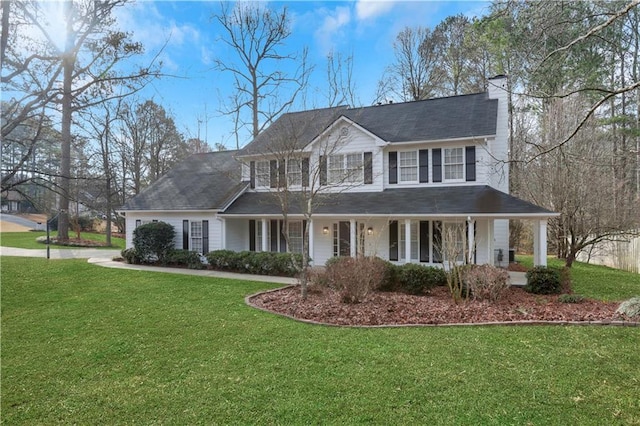 view of front of home with a front lawn and covered porch