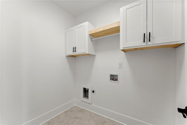 laundry room with cabinet space, baseboards, washer hookup, and electric dryer hookup