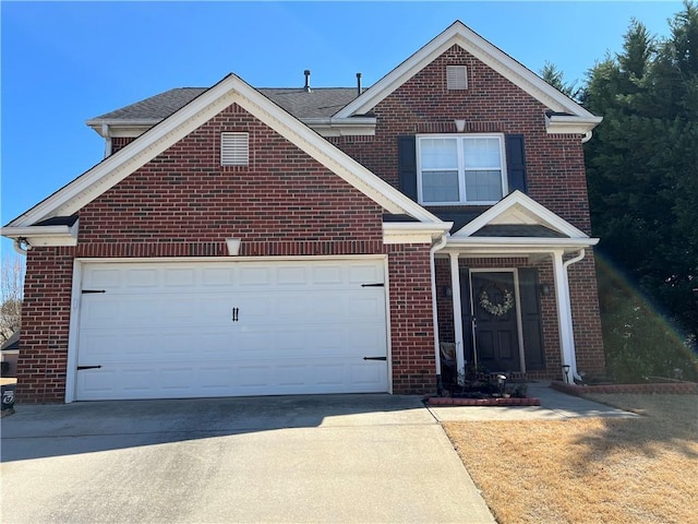 traditional-style home with an attached garage, brick siding, and driveway