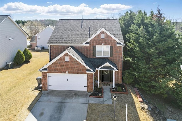 traditional-style house with brick siding, concrete driveway, roof with shingles, a front yard, and a garage