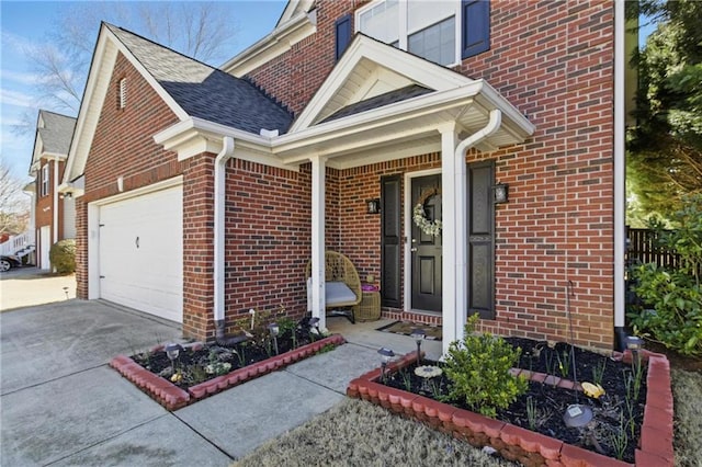 exterior space with brick siding, an attached garage, a shingled roof, and driveway