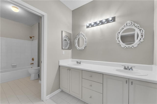 full bathroom with tile patterned floors, vanity, tiled shower / bath combo, and toilet