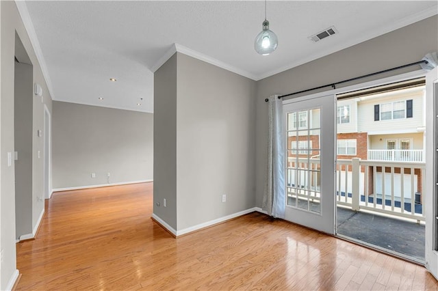 doorway to outside featuring light hardwood / wood-style floors and ornamental molding