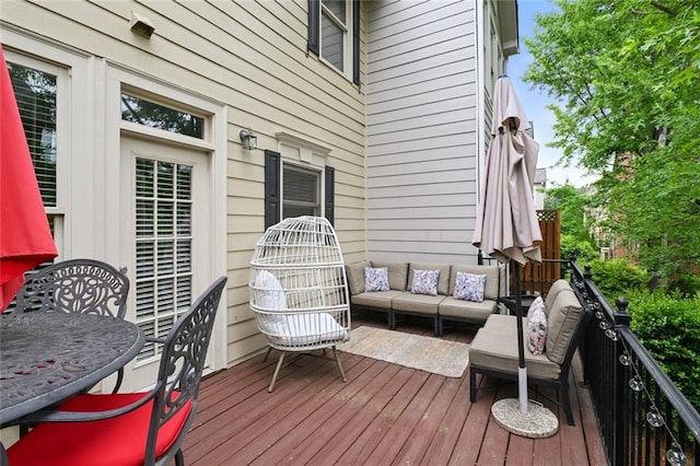 wooden deck featuring an outdoor living space and outdoor dining area