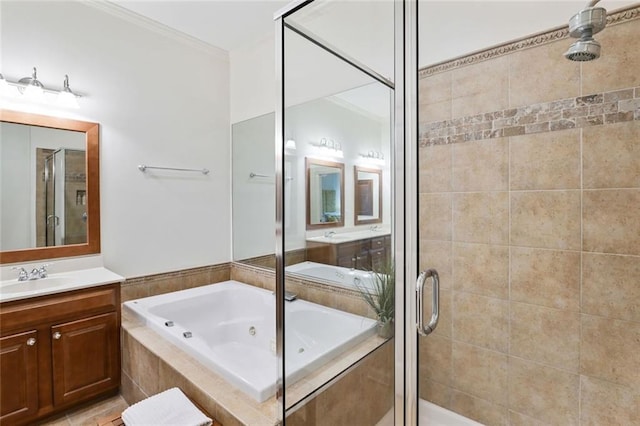full bathroom with vanity, ornamental molding, a whirlpool tub, and a stall shower