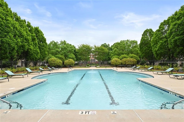 pool featuring a patio and fence