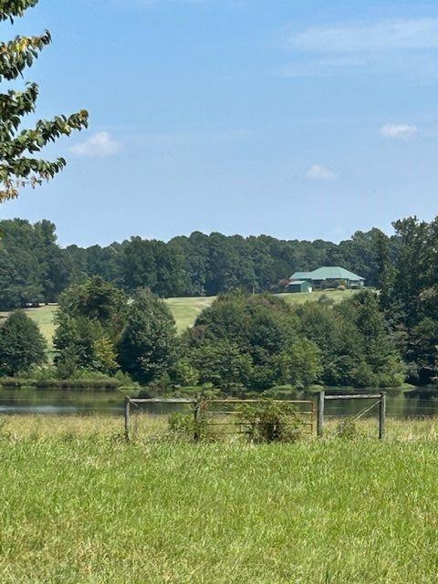 mountain view with a rural view and a water view