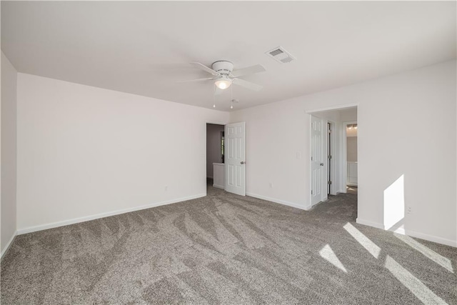 unfurnished bedroom featuring a ceiling fan, carpet flooring, visible vents, and baseboards