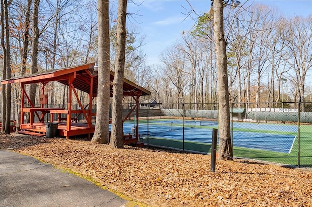 view of tennis court with fence