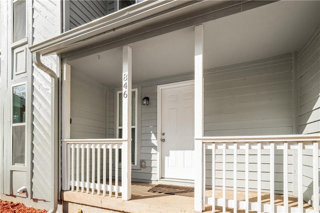 doorway to property featuring covered porch