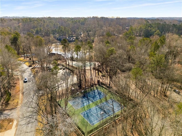 drone / aerial view featuring a forest view