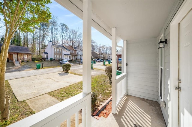 view of patio / terrace with a porch and a residential view