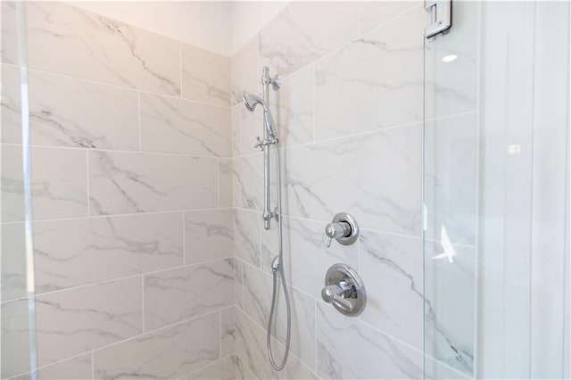 bathroom with tiled shower