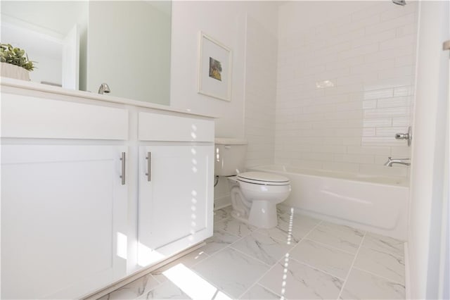 full bathroom with vanity, toilet, and tiled shower / bath