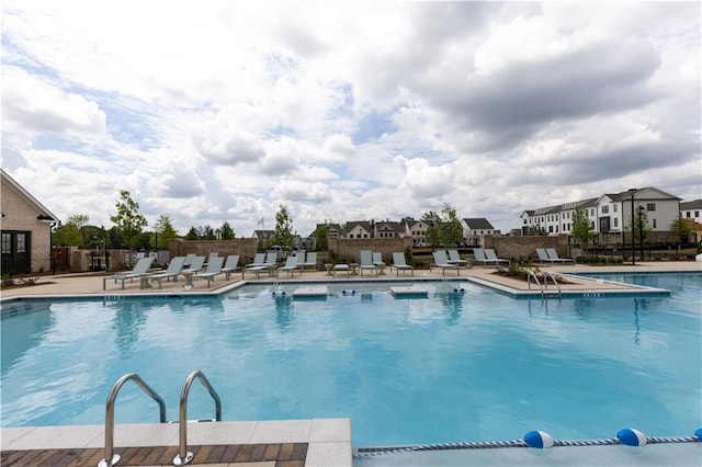 view of pool featuring a patio