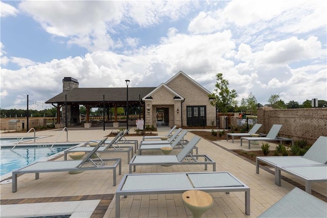 view of swimming pool with a patio area