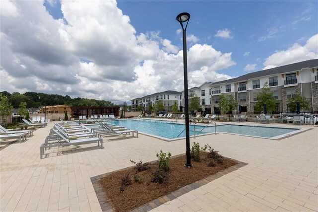 view of pool featuring a patio