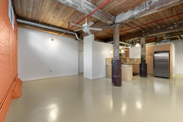 basement featuring freestanding refrigerator, a ceiling fan, and wood ceiling