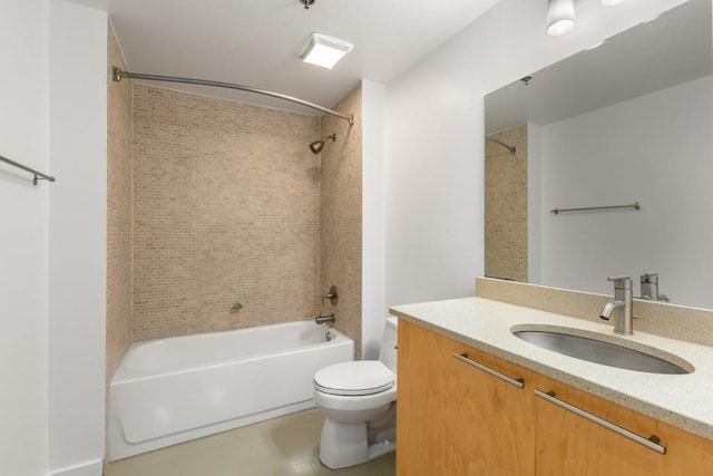 bathroom featuring toilet, vanity, and bathing tub / shower combination