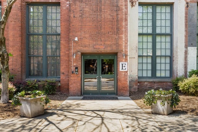 entrance to property with french doors and brick siding