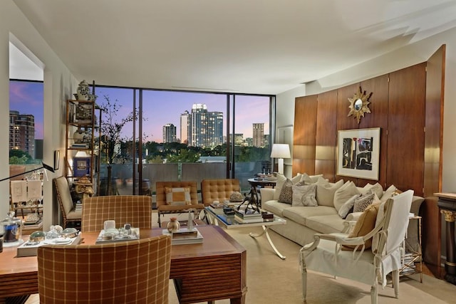 living room featuring light carpet and floor to ceiling windows