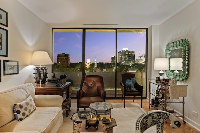 living area featuring floor to ceiling windows and light parquet flooring