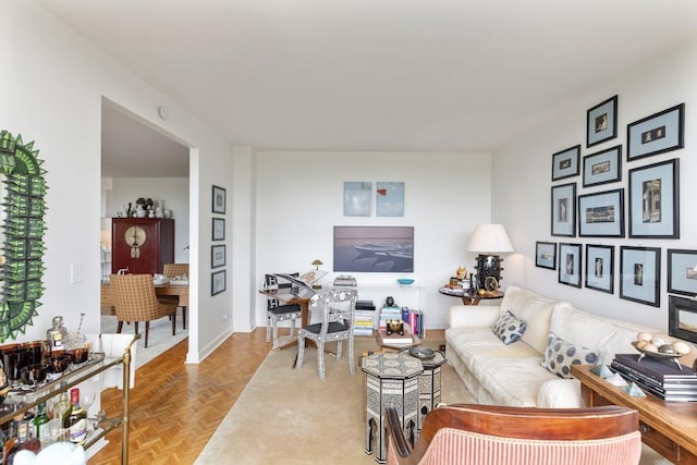 living room featuring parquet floors