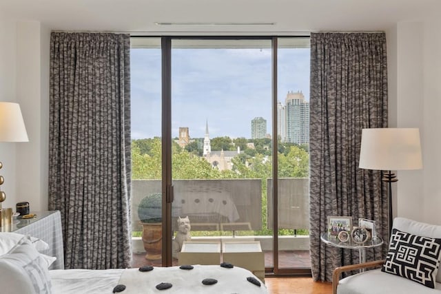 bedroom featuring multiple windows and access to exterior