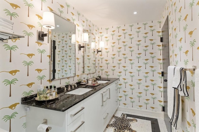 bathroom with tile patterned flooring and vanity