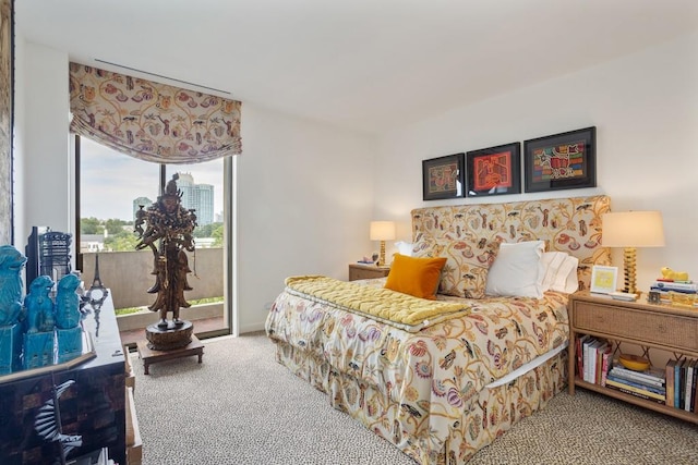 bedroom featuring carpet floors and access to exterior