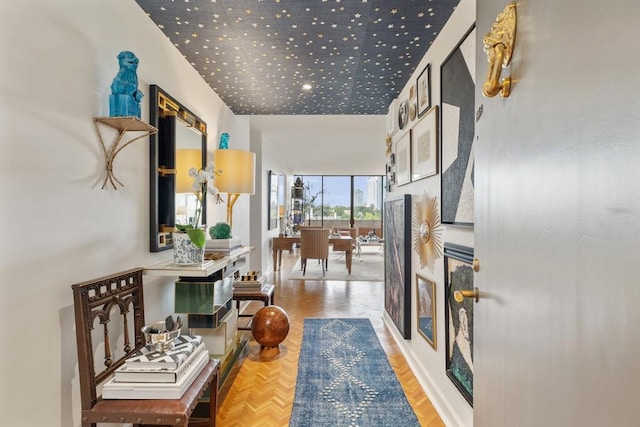 hallway featuring parquet flooring