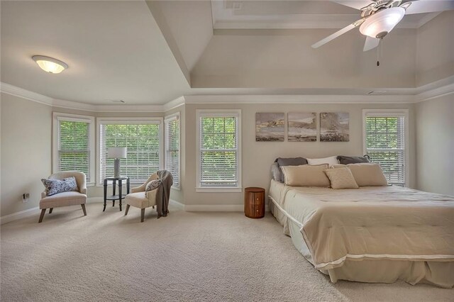 carpeted bedroom with baseboards, multiple windows, crown molding, and a ceiling fan
