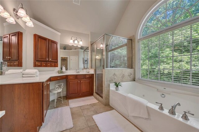 bathroom featuring a tub with jets, vanity, tile patterned floors, a stall shower, and lofted ceiling