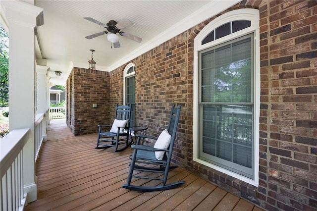 deck with covered porch and a ceiling fan