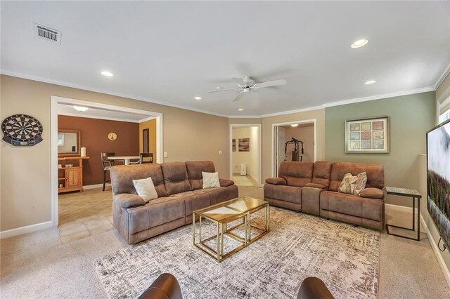 living area with a ceiling fan, recessed lighting, carpet flooring, baseboards, and ornamental molding