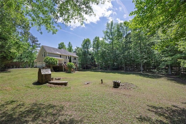 view of grassy yard featuring an attached garage