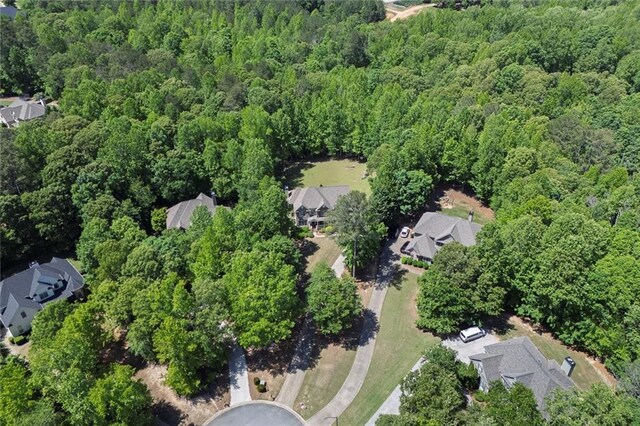 aerial view of property's location with a forest