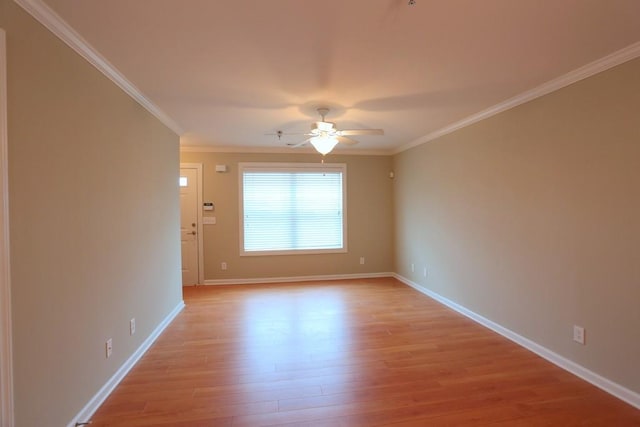 unfurnished room with ceiling fan, light hardwood / wood-style floors, and ornamental molding