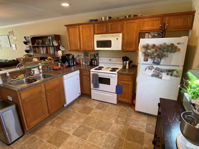 kitchen featuring kitchen peninsula, sink, white appliances, and ornamental molding