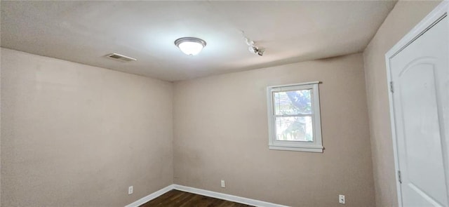 empty room featuring dark hardwood / wood-style floors