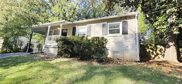 view of front of property with a front yard and a porch