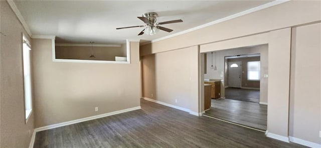 spare room featuring dark hardwood / wood-style floors, ceiling fan, and ornamental molding