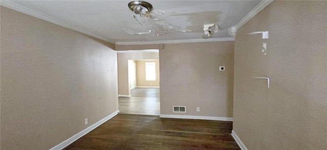 empty room with dark hardwood / wood-style floors and crown molding