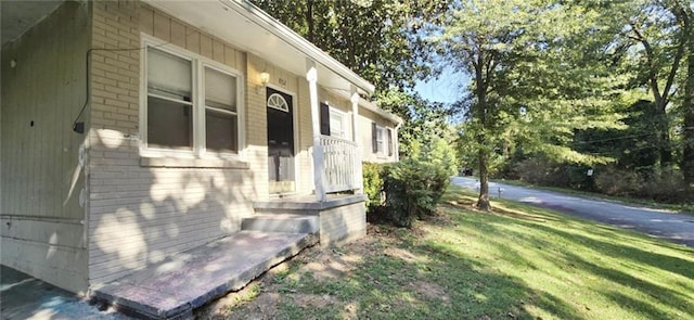 view of property exterior with a yard