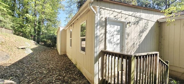 view of side of home with a deck