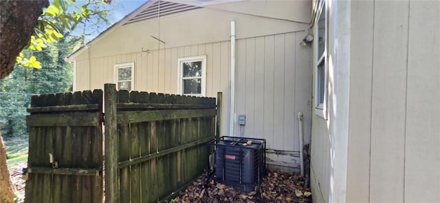 view of side of property featuring central air condition unit